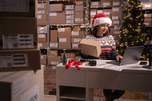 worker in shipping department wearing Santa hat