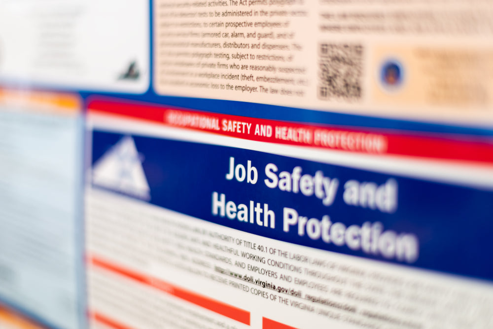 Close-up of OSHA Job Safety and Health Protection labor law poster required in workplaces