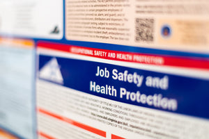Close-up of OSHA Job Safety and Health Protection labor law poster required in workplaces