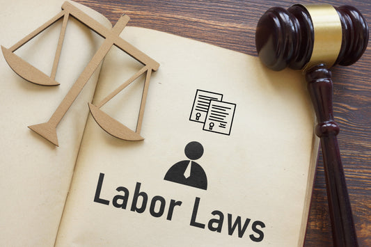 Labor Law notebook with scales and gavel.