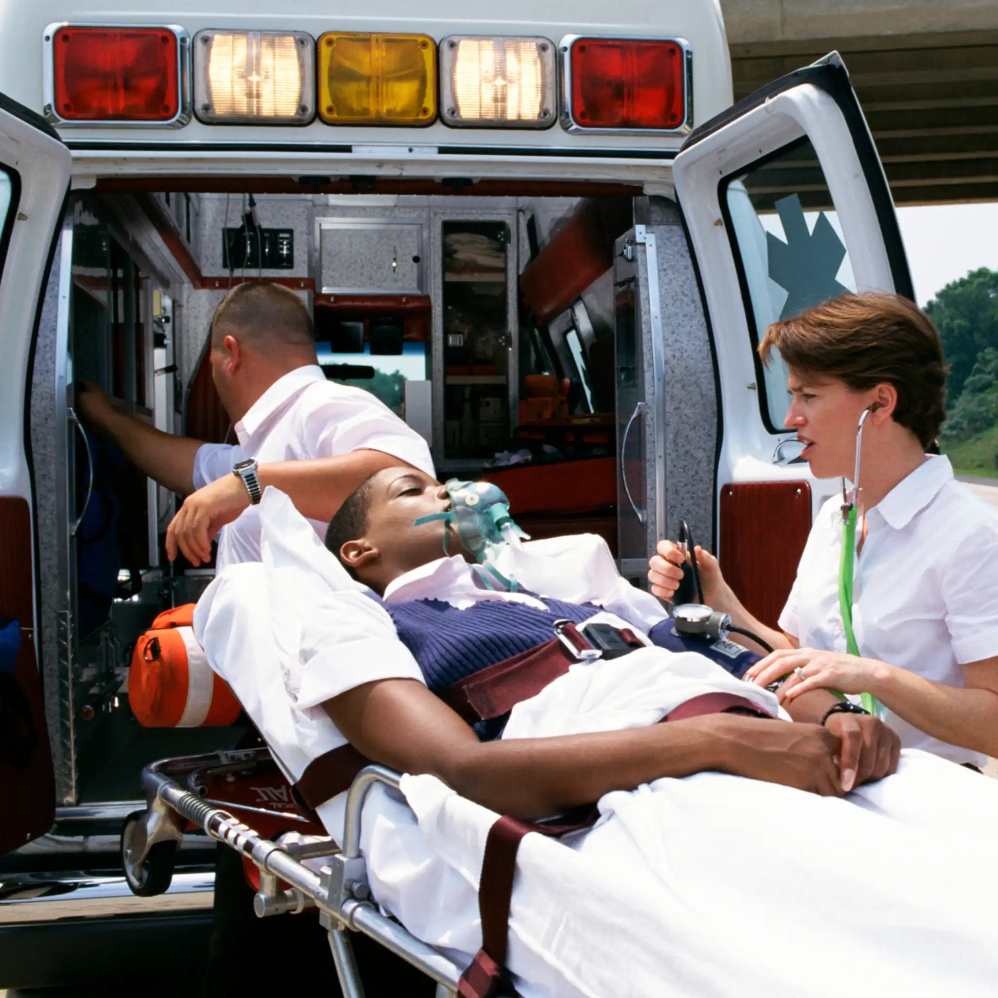 Office Safety Streaming Woman Going into Ambulance