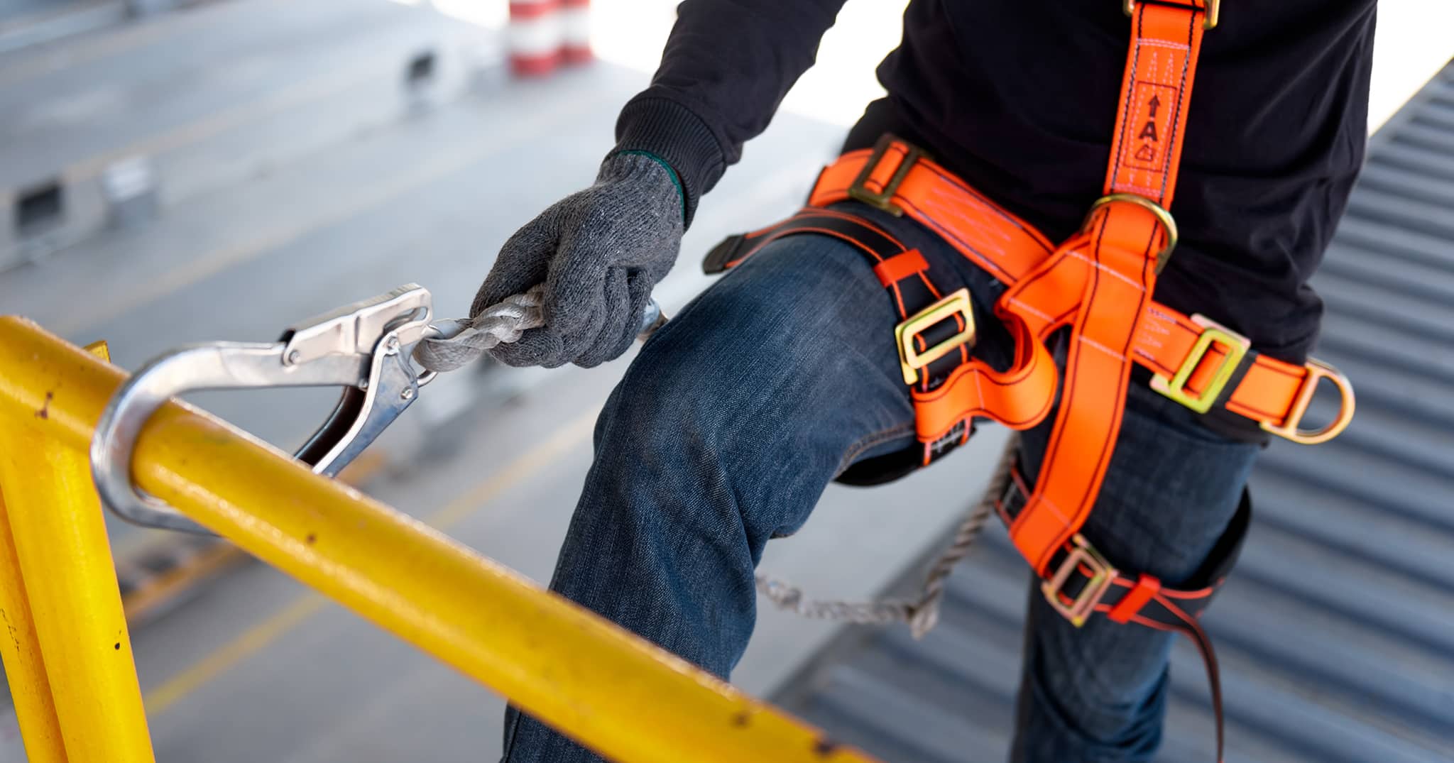 Worker using fall protection system